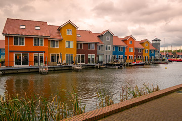 Fototapeta na wymiar Beautiful houses in the Netherlands, province Groningen, city Groningen neighbourhood is called Reitdiephaven