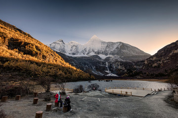 Fototapeta premium Holy mountain yangmaiyong with lake in autumn valley