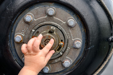 Child pointing at Mechanical setting for anti-submarine depth charge