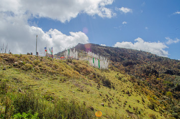 En route to Chele la pass vantage point surrounded by white and colorful prayer flags