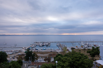 Fototapeta premium Amazing view to the sea and the marina in Kalamaria, Thessaloniki, Greece, under a cloudy sky