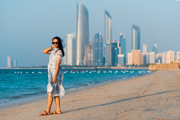 Female tourist on Abu Dhabi city beach