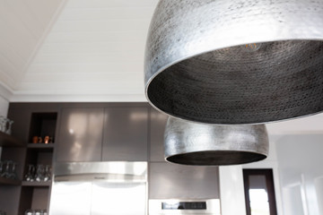 Silver light fixture in kitchen