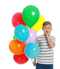 Fototapeta na wymiar Emotional little boy holding bunch of colorful balloons on white background