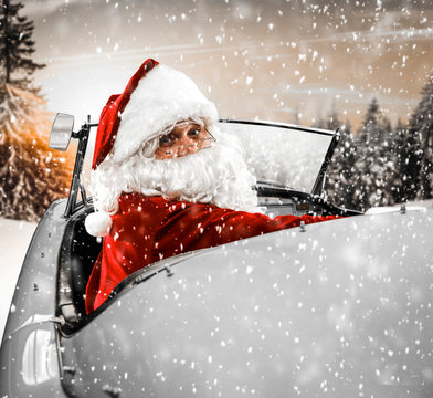 Red old santa claus and winter car 