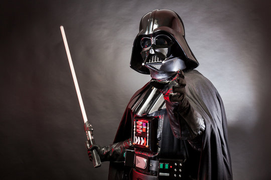 SAN BENEDETTO DEL TRONTO, ITALY. MAY 16, 2015. Portrait of Darth Vader costume replica with grab hand and his sword. Darth Vader or Dart Fener is a fictional character of Star Wars saga.