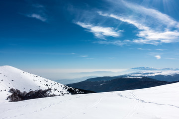 Fototapeta na wymiar Snowy slopes in 3-5 Pigadia ski center, Naoussa, Greece