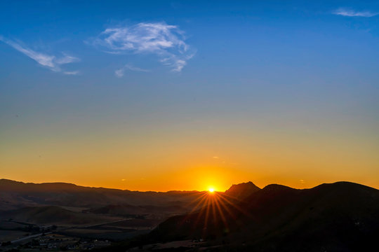 Sunburst above Horizon at Dawn © Mark