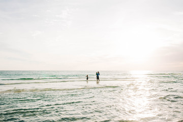 Sunset over Ocean with People