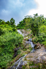 Fototapeta na wymiar mall Waterfall in Orocovis, Puerto Rico. Pequena cascada en Orocovis, Puerto Rico.