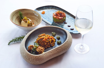 Mediterranean food plates on white with rosemary