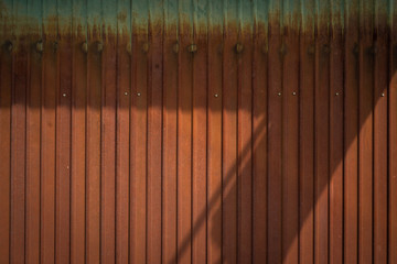 The old wall rusted zinc. Shading of light  rusty brown Zinc 