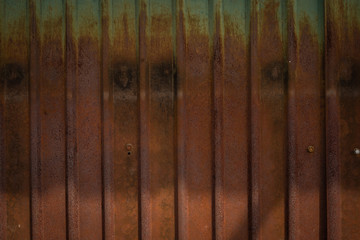 The old wall rusted zinc. Shading of light  rusty brown Zinc 