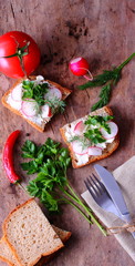  Delicious sandwiches with fresh vegetables on table.