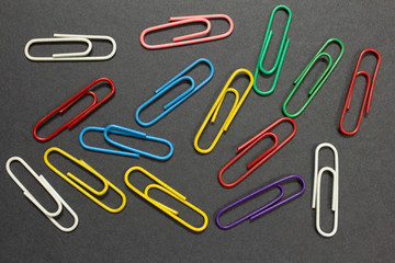 View of paperclips over a black colour background