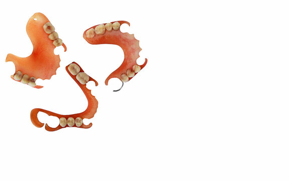Old used denture isolate on white background