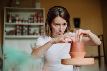 Ceramic artist with cup