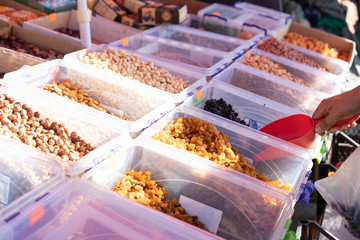 Dried fruits on counter for sale.