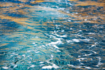 The trace of the motor in the sea water. Wake of a ferry boat