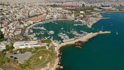 Fototapeta premium Aerial drone bird's eye view panoramic photo of iconic round shaped picturesque port of Mikrolimano with sail boats and yachts docked, Piraeus port, Attica, Greece