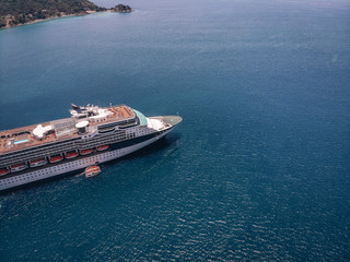 Side top view of the amazing cruise ship having a voyage by sea near the islands; cruising, lifestyle.