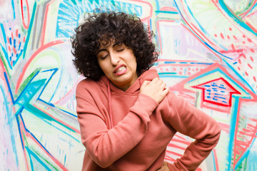 young pretty afro woman feeling tired, stressed, anxious, frustrated and depressed, suffering with...