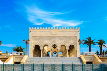 View of the snow-white Mausoleum of Mohammed V against the blue sky. Rabat, Morocco - obrazy, fototapety, plakaty