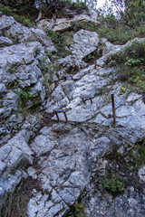 Iron rods in rock towards Spik