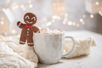 Gingerbread cookie man with a hot chocolate for Christmas holiday