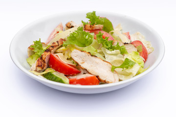 white deep plates with fresh salad ingredients mixed with sauce placed on isolated white background. A place for a menu, banner or advertisement