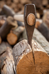 Ax stuck in the stump. wooden stump in the forest. Deforestation man. Felled tree. Woodcutter's ax on the stump.