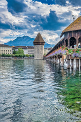 The Chapel Bridge (Kapellbrucke) a covered wooden truss footbridge spanning the River Reuss in the...