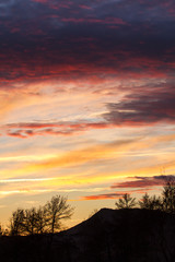 Golden sky with red clouds.