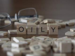 The concept of Oily represented by wooden letter tiles