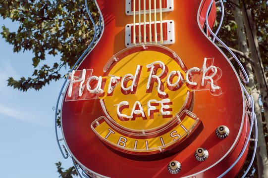 TBILISI, GEORGIA - OCT 10: Guitar at entrance of Hard Rock Cafe, the popular rock'n'roll bar on October 10, 2016. Chain of theme restaurants founded in 1971, now it works in 59 countries.