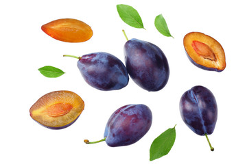 fresh plum fruit with green leaf and cut plum slices isolated on white background. top view