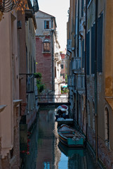 Fototapeta na wymiar Venice, Italy. View of ancient buildings and narrow canal in San Marco, district in Venice