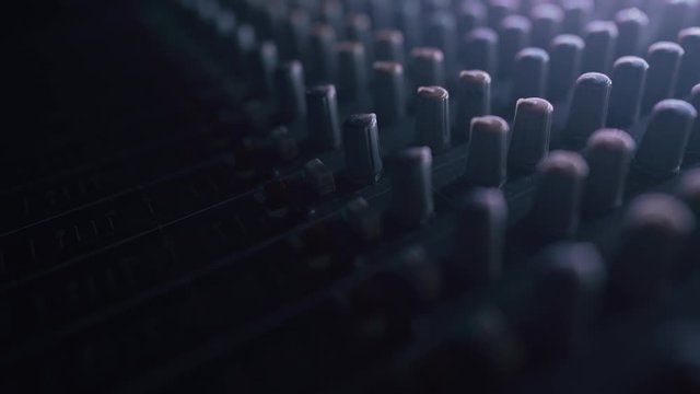 Close up of mixing console. Professional Recording Studio. Interface of equipment for sound processing. Fader.