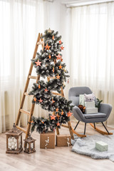 christmas tree in a stylish room.  copy space