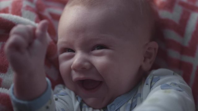 Shy smile from a newborn baby 