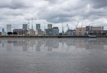 Antwerp, Belgium - 20 August 2019: Skyline of the Northern part of Antwerp, reflected