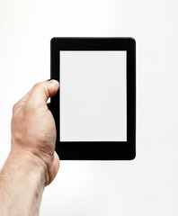 Man hand holds e-book on white background. Modern technology for knowledge concept