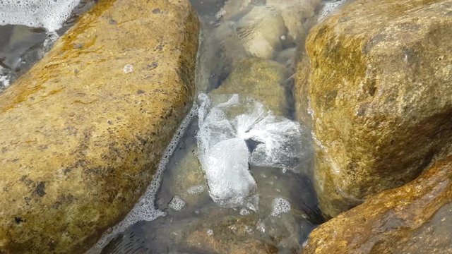 A plastic bag floating on the waves in the Mediterranean Sea