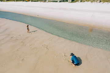 Father and Child Playing at Beach