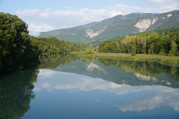 Naklejka na ściany i meble mirror reflection of the mountains in the river