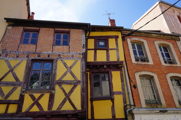 Fototapeta na wymiar old half timbered colorful houses facade in the southern Alps, France