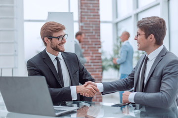business people shaking hands during a business meeting.
