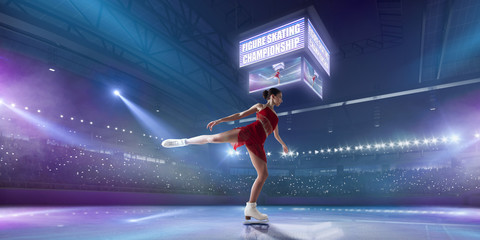 Figure skating girl in ice arena.