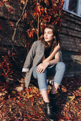 Close up portrait of young brunette stylish trendy girl outdoors in autumn park. Beauty, seasons, modeling, art, inspiration concept