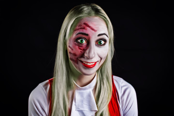 gray haired witch with green eyes on a black background for Halloween